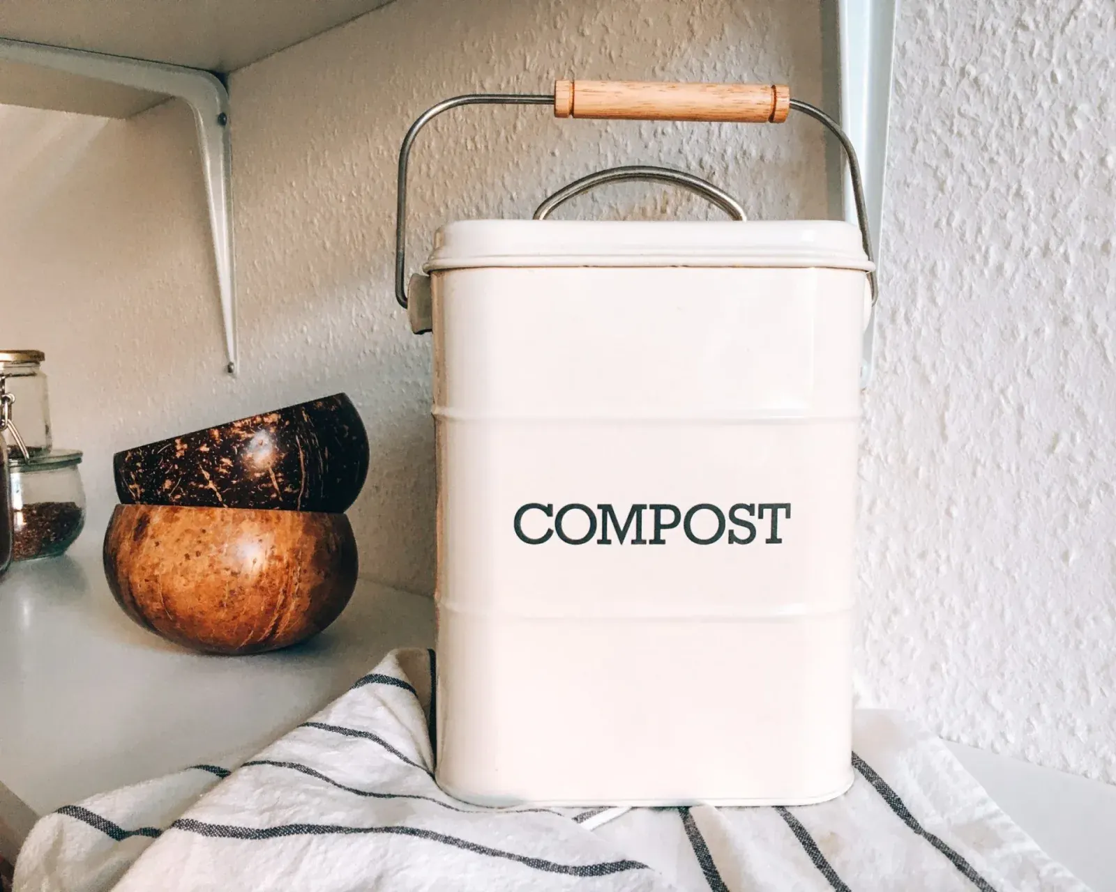 A closed compost container with a filtered lid